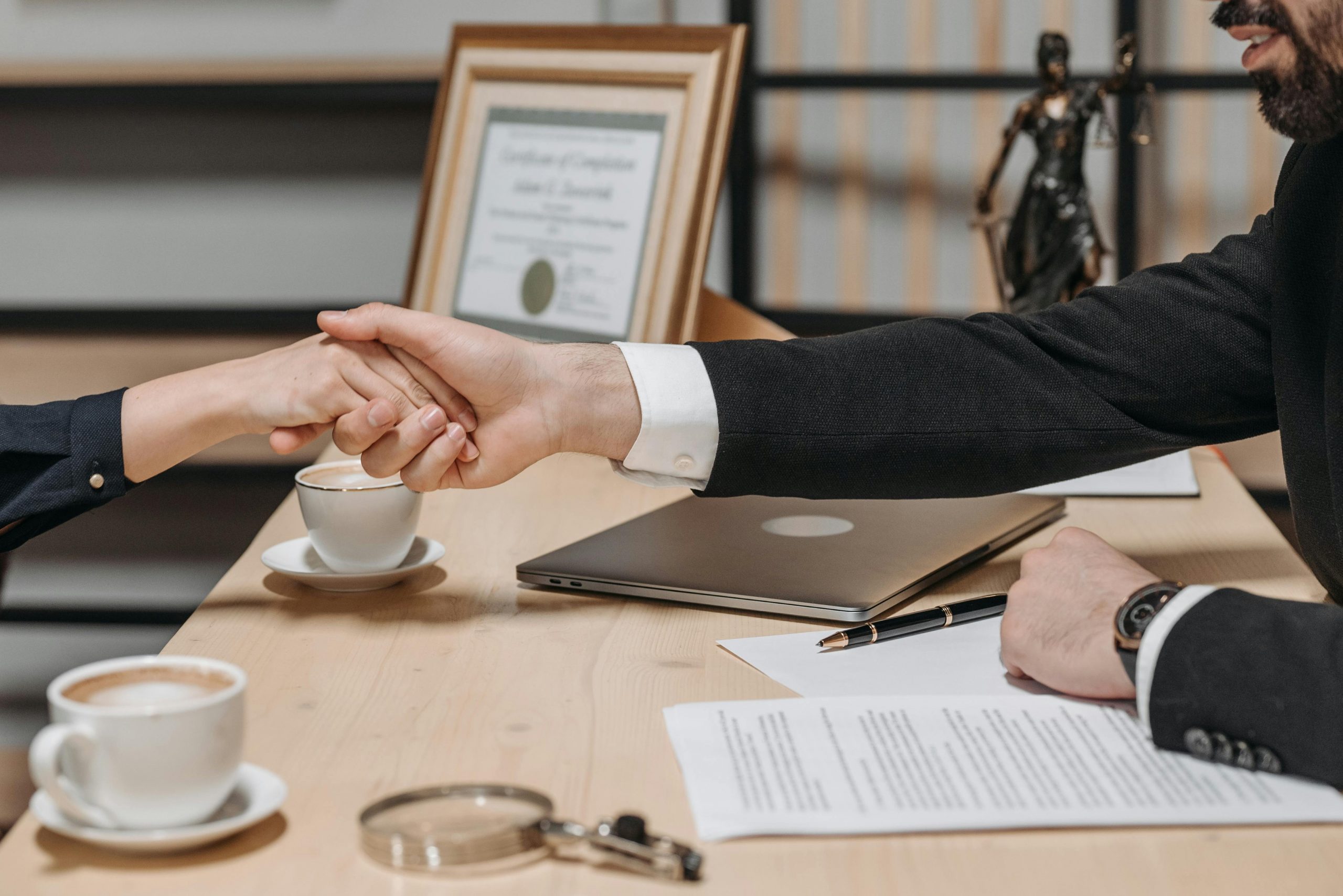 lawyer and his client shaking hands